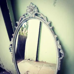 Beautiful painted vintage ornate mirror in soft blue