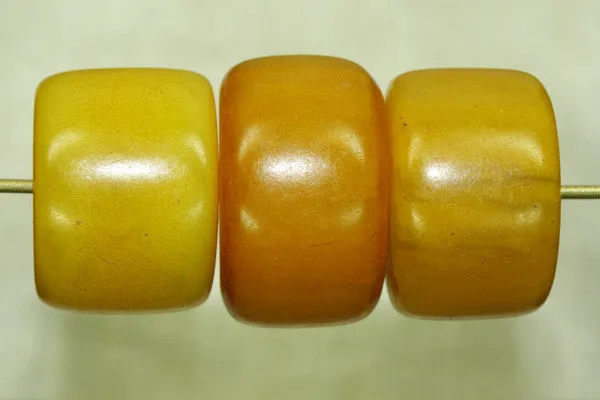 Pale yellow amber cylindrical bead