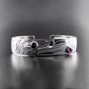 Elegant Sterling Silver Bracelet Featuring Raven Design with Garnet Accents