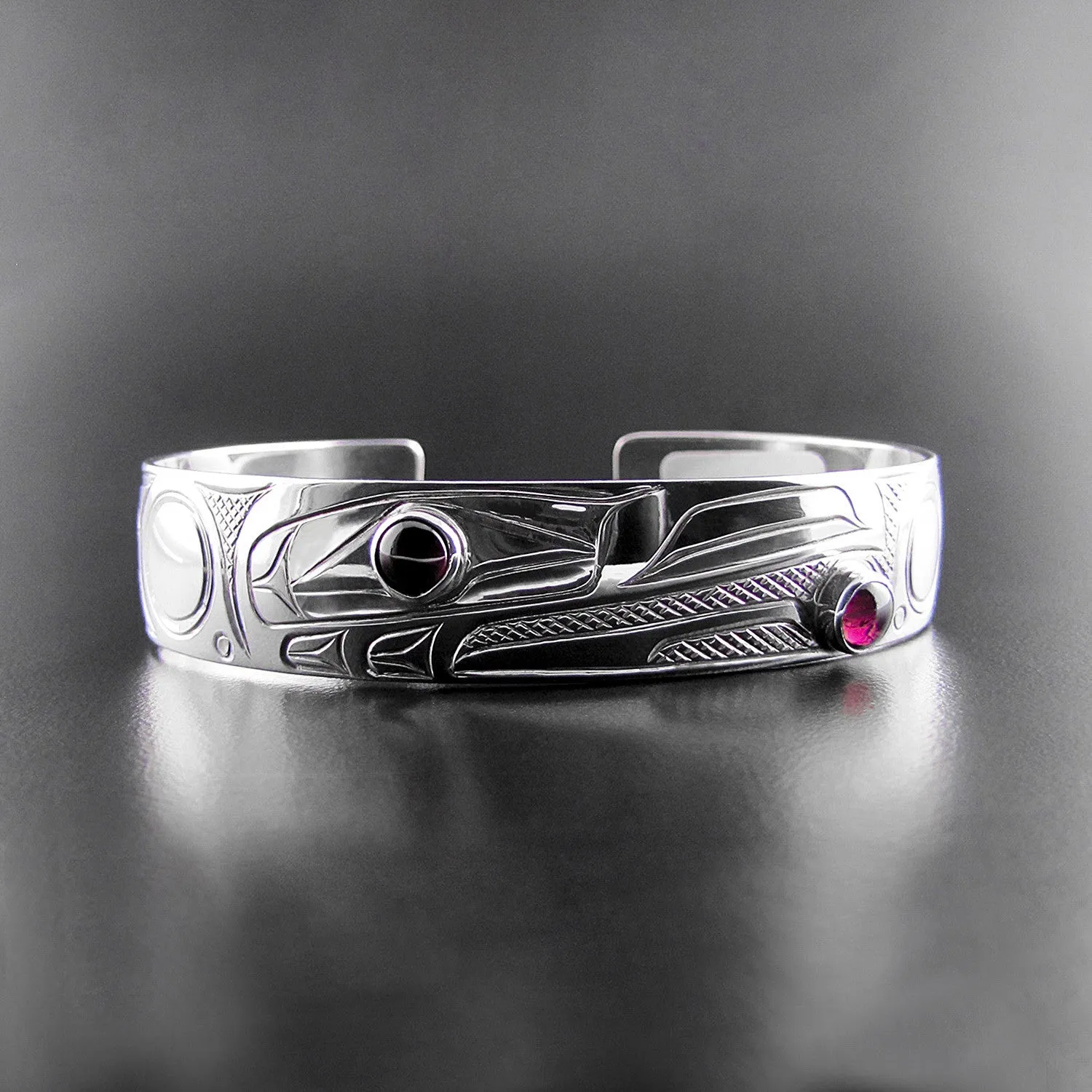 Elegant Sterling Silver Bracelet Featuring Raven Design with Garnet Accents